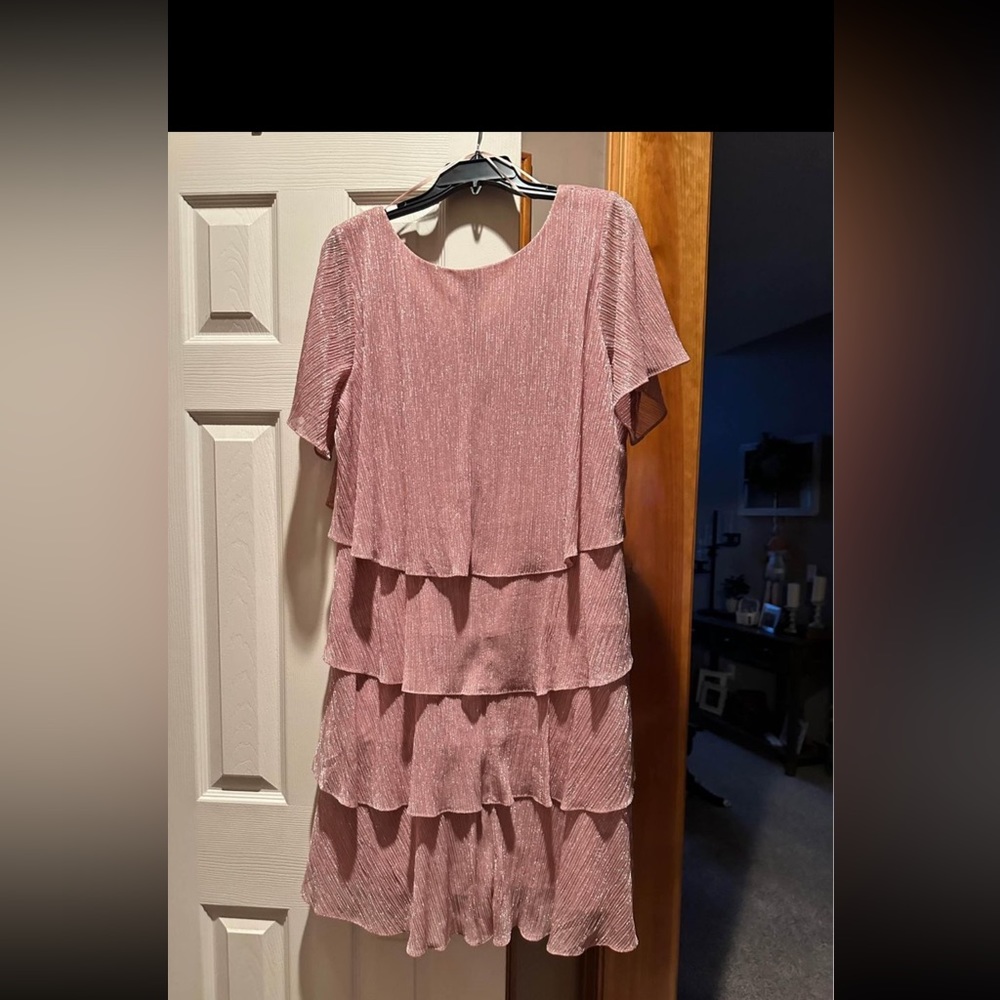 Size 14 ladies dress in Rose Gold.  Only worn 1 time for a wedding.